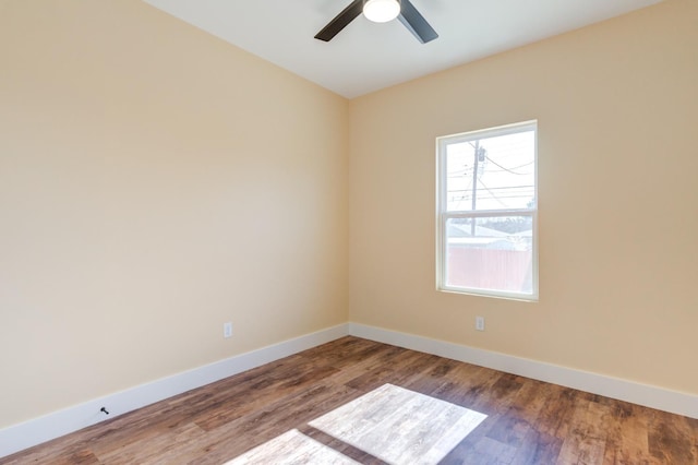 empty room featuring hardwood / wood-style flooring and ceiling fan