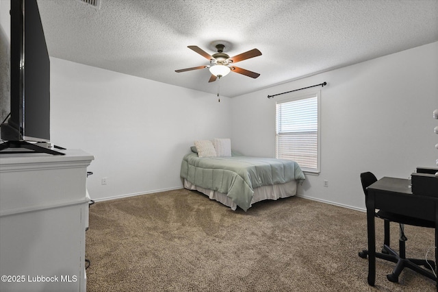 1709 76th St, Lubbock, TX 79423 - bedroom featuring carpet flooring, a textured ceiling, and a ceiling fan