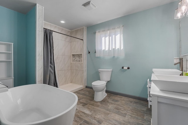 full bathroom with vanity, independent shower and bath, and toilet