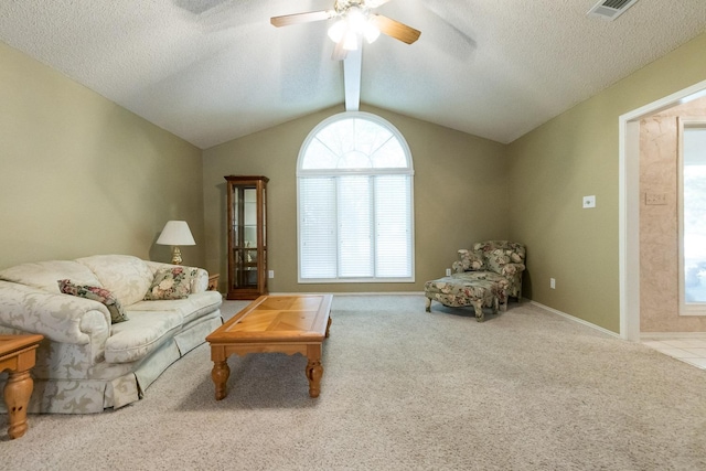 9613 Vicksburg Ave, Lubbock, TX 79424 - carpeted living room with ceiling fan, vaulted ceiling, and a textured ceiling