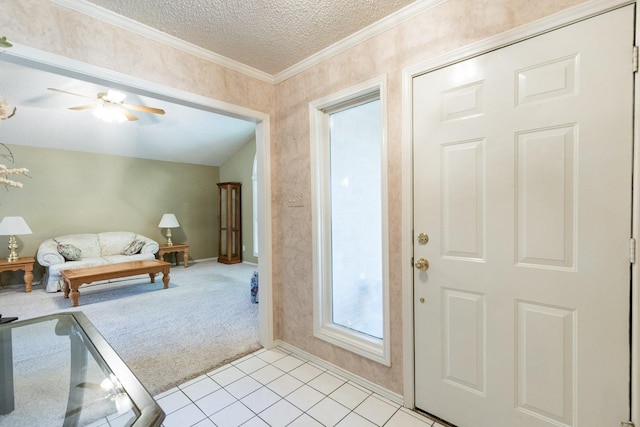 9613 Vicksburg Ave, Lubbock, TX 79424 - entrance foyer with a textured ceiling, light colored carpet, light tile patterned floors, ceiling fan, and ornamental molding