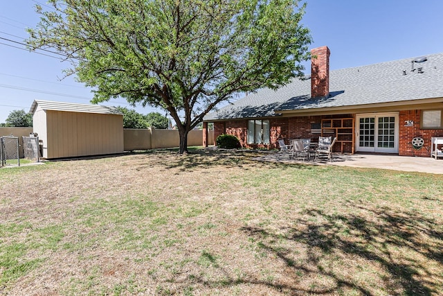 9613 Vicksburg Ave, Lubbock, TX 79424 - view of yard with a patio, french doors, and a storage shed