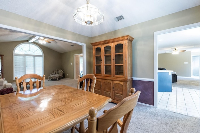 9613 Vicksburg Ave, Lubbock, TX 79424 - dining room with a ceiling fan, lofted ceiling, light colored carpet, a chandelier, and light tile patterned floors