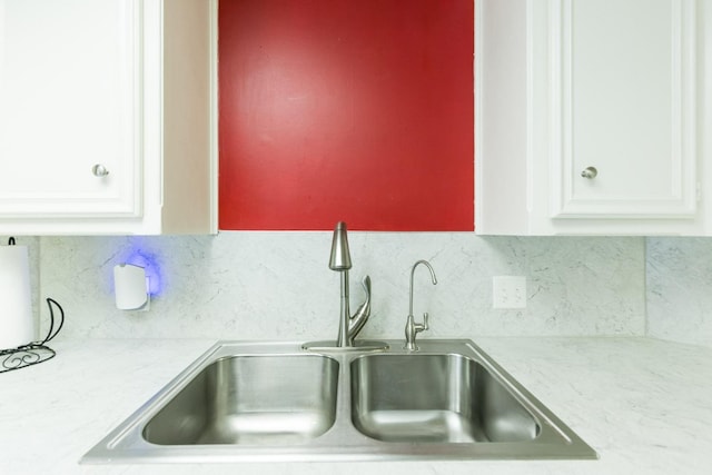9613 Vicksburg Ave, Lubbock, TX 79424 - kitchen featuring light countertops, white cabinetry, and decorative backsplash