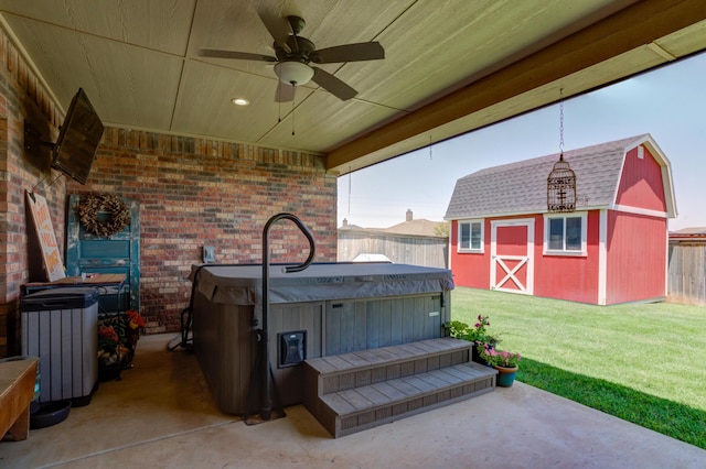 4902 Marshall St, Lubbock, TX 79416 - fenced backyard featuring a hot tub, ceiling fan, a patio area, and a shed