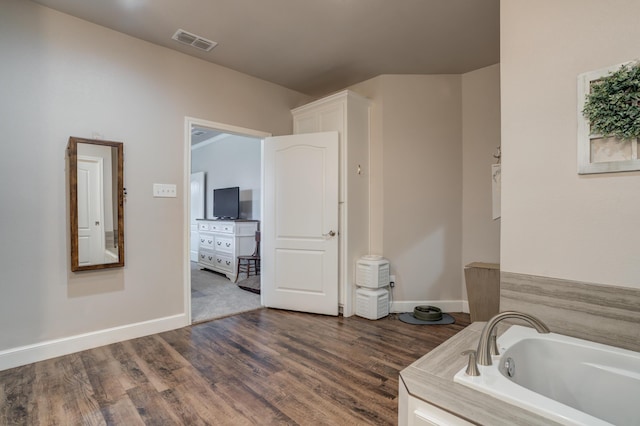 4902 Marshall St, Lubbock, TX 79416 - bathroom with a garden tub and wood finished floors