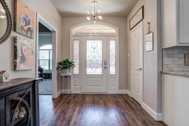4902 Marshall St, Lubbock, TX 79416 - foyer with a chandelier and dark wood-type flooring