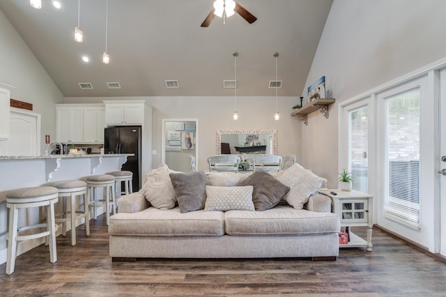 4902 Marshall St, Lubbock, TX 79416 - living area featuring high vaulted ceiling, ceiling fan, dark wood-type flooring, and healthy amount of natural light
