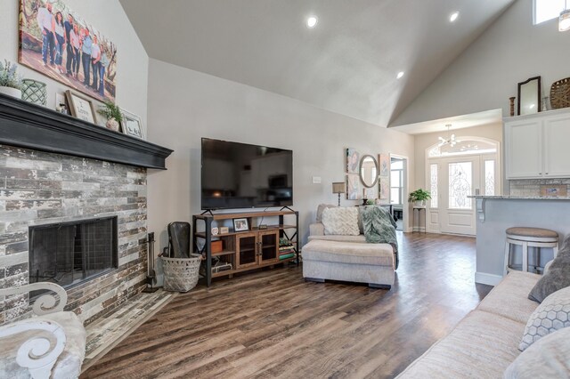 4902 Marshall St, Lubbock, TX 79416 - living room with a chandelier, wood finished floors, high vaulted ceiling, a fireplace, and recessed lighting