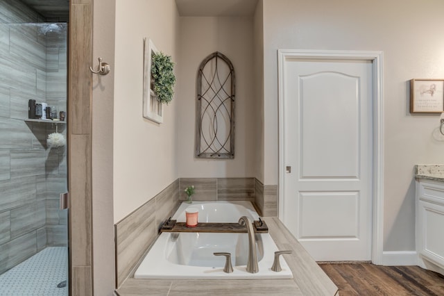 4902 Marshall St, Lubbock, TX 79416 - full bath with a shower stall, a garden tub, vanity, and wood finished floors