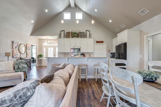 4902 Marshall St, Lubbock, TX 79416 - living room featuring high vaulted ceiling, dark wood-type flooring, beamed ceiling, recessed lighting, and a chandelier