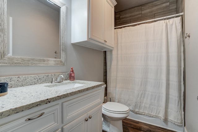 4902 Marshall St, Lubbock, TX 79416 - bathroom featuring vanity, wood finished floors, and shower / bath combo