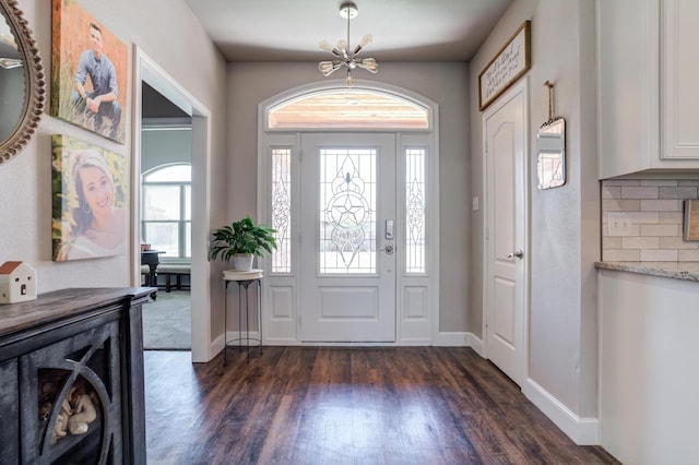 4902 Marshall St, Lubbock, TX 79416 - entrance foyer featuring a chandelier and dark wood-style floors