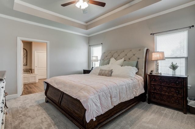 4902 Marshall St, Lubbock, TX 79416 - bedroom featuring a tray ceiling, crown molding, light carpet, ensuite bathroom, and a ceiling fan