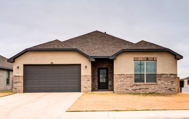 view of front of home with a garage