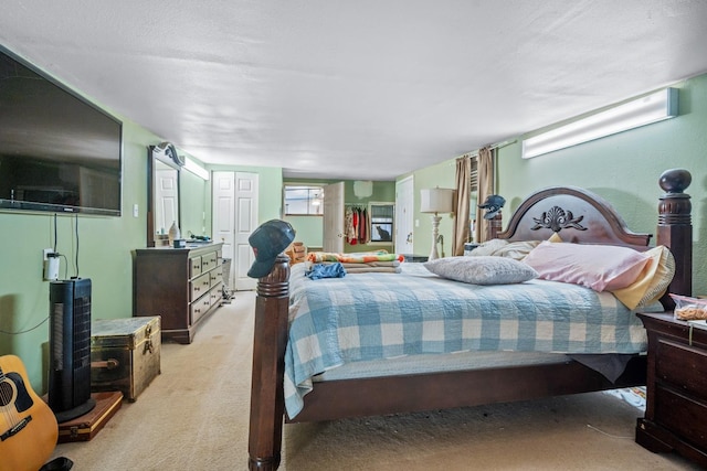 bedroom featuring light colored carpet