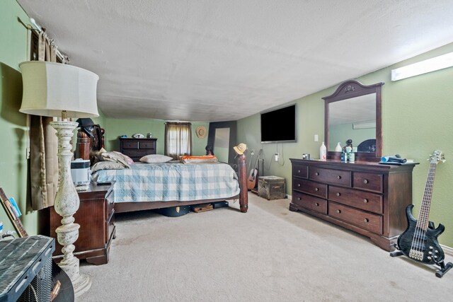 carpeted bedroom with a textured ceiling