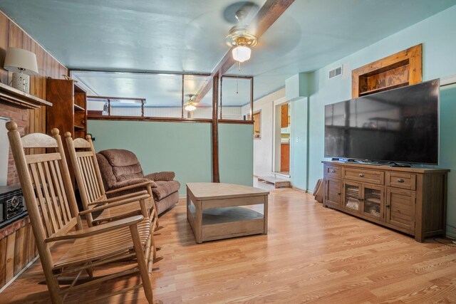 living room featuring ceiling fan and light wood-type flooring