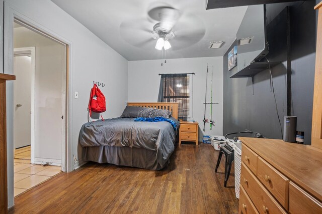 bedroom featuring ceiling fan and hardwood / wood-style floors