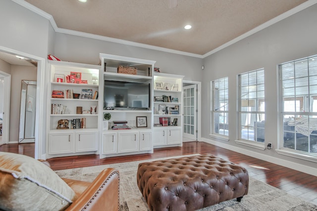 living room with wood-type flooring, baseboards, crown molding, and recessed lighting