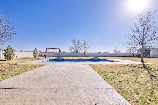 exterior space featuring a yard, a patio, a fenced backyard, and a fenced in pool