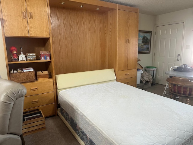 carpeted bedroom with a textured ceiling