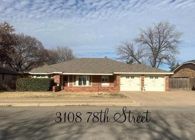 single story home featuring a garage