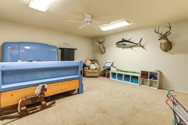 bedroom with ceiling fan and carpet floors