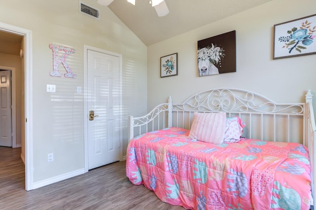 bedroom featuring hardwood / wood-style flooring, ceiling fan, and lofted ceiling