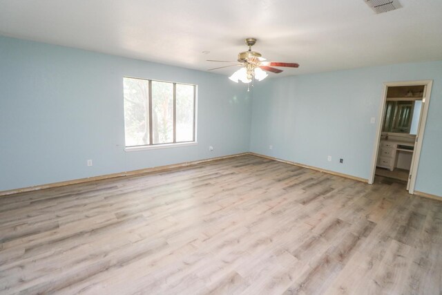 unfurnished room with ceiling fan and light hardwood / wood-style flooring