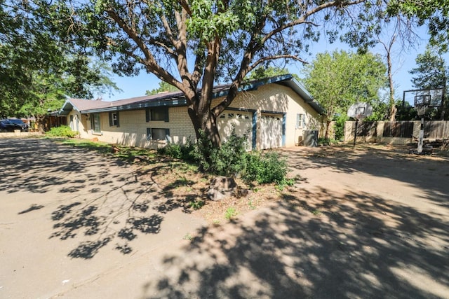 view of side of home with a garage