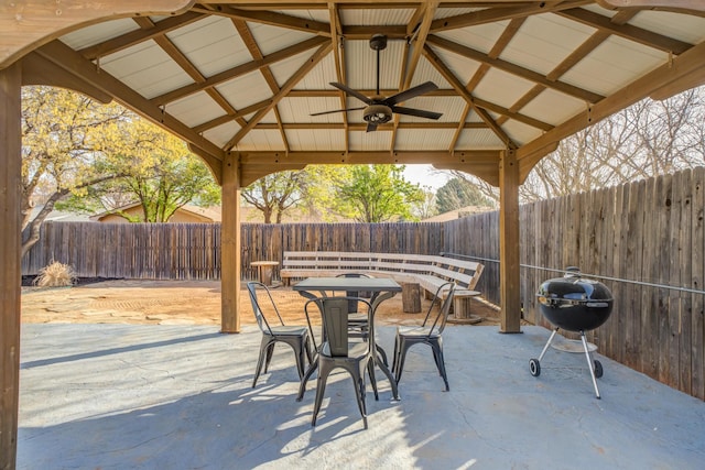 view of patio featuring a gazebo, a grill, and a fenced backyard