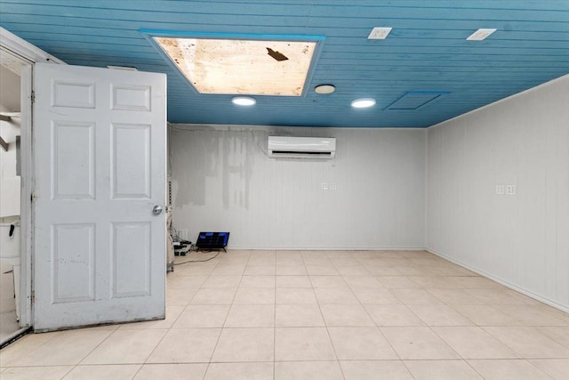 tiled spare room with a wall mounted air conditioner