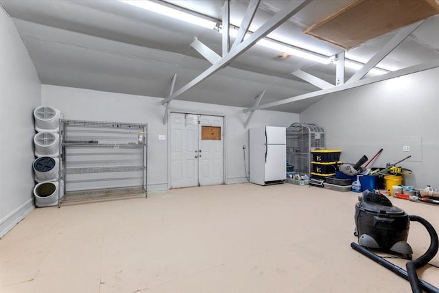 garage with white refrigerator