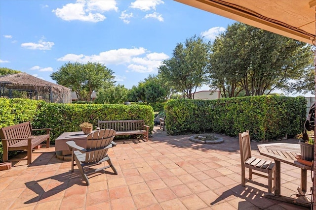 view of patio / terrace featuring an outdoor fire pit