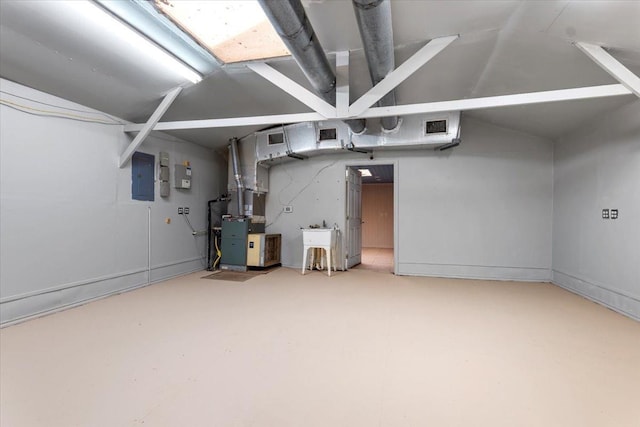 basement featuring heating unit and electric panel