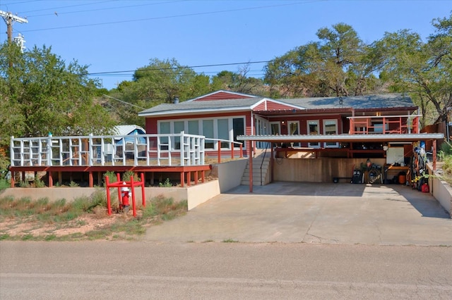 view of front facade featuring a carport and a deck