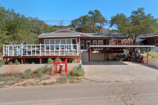 view of front of property featuring a carport