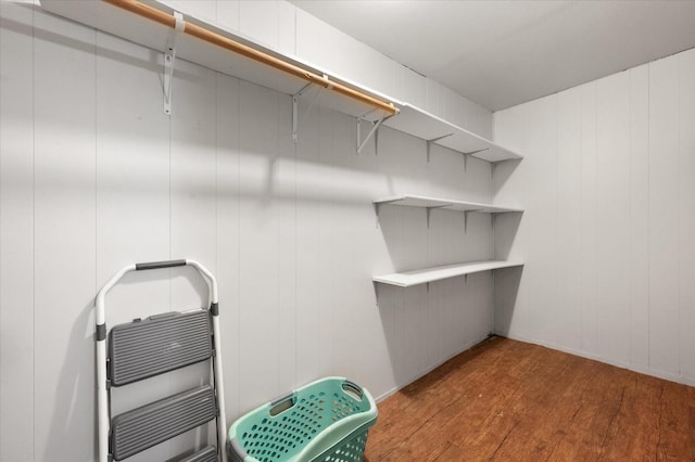 spacious closet with wood-type flooring and heating unit