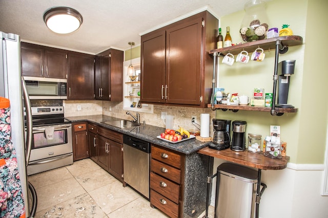 kitchen featuring tasteful backsplash, appliances with stainless steel finishes, a sink, and open shelves