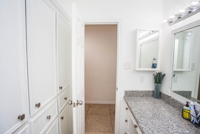 bathroom with vanity and tile patterned flooring