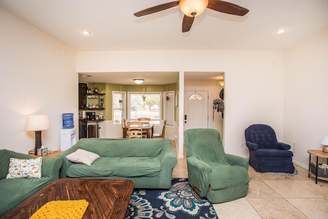 tiled living room featuring baseboards, a ceiling fan, and recessed lighting
