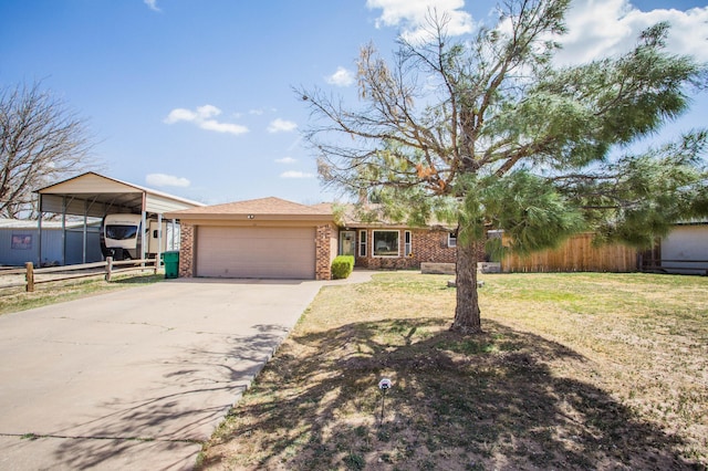 view of front facade featuring fence, a front lawn, brick siding, an attached garage, and concrete driveway