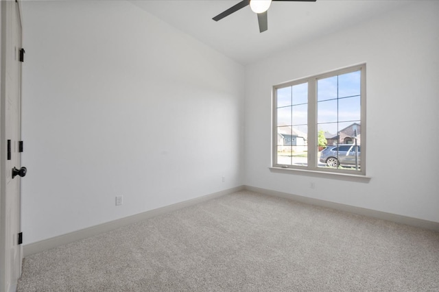 empty room featuring carpet floors and ceiling fan