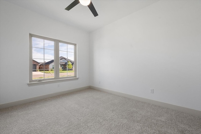 empty room featuring carpet and ceiling fan