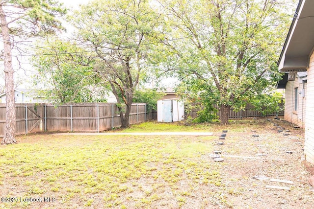 303 Comanche Trl, Tulia, TX 79088 - fenced backyard featuring a storage unit