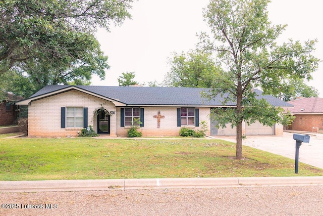 303 Comanche Trl, Tulia, TX 79088 - ranch-style home with concrete driveway, brick siding, a front yard, an attached garage, and roof with shingles