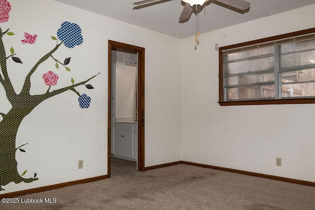 303 Comanche Trl, Tulia, TX 79088 - carpeted empty room featuring a ceiling fan and a textured ceiling