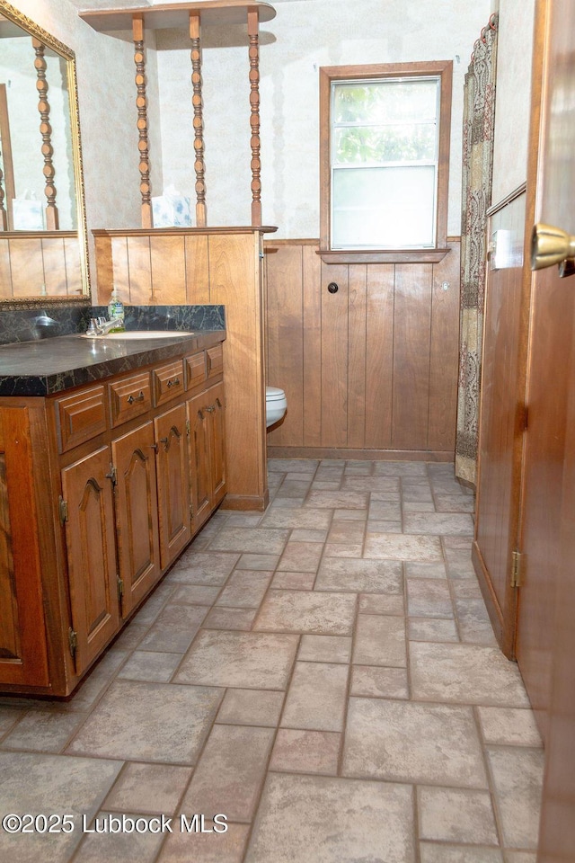 303 Comanche Trl, Tulia, TX 79088 - bathroom featuring brick patterned floors and vanity