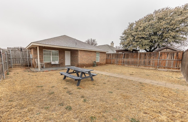 view of yard with a fenced backyard